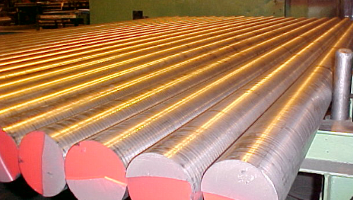 A row of Ductile Iron rods that are laid out to cool